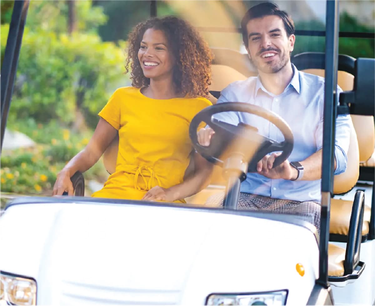Happy Couple enjoying a cart charged by the MR/1